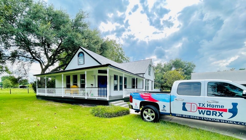 Texas home with porch and truck in yard.