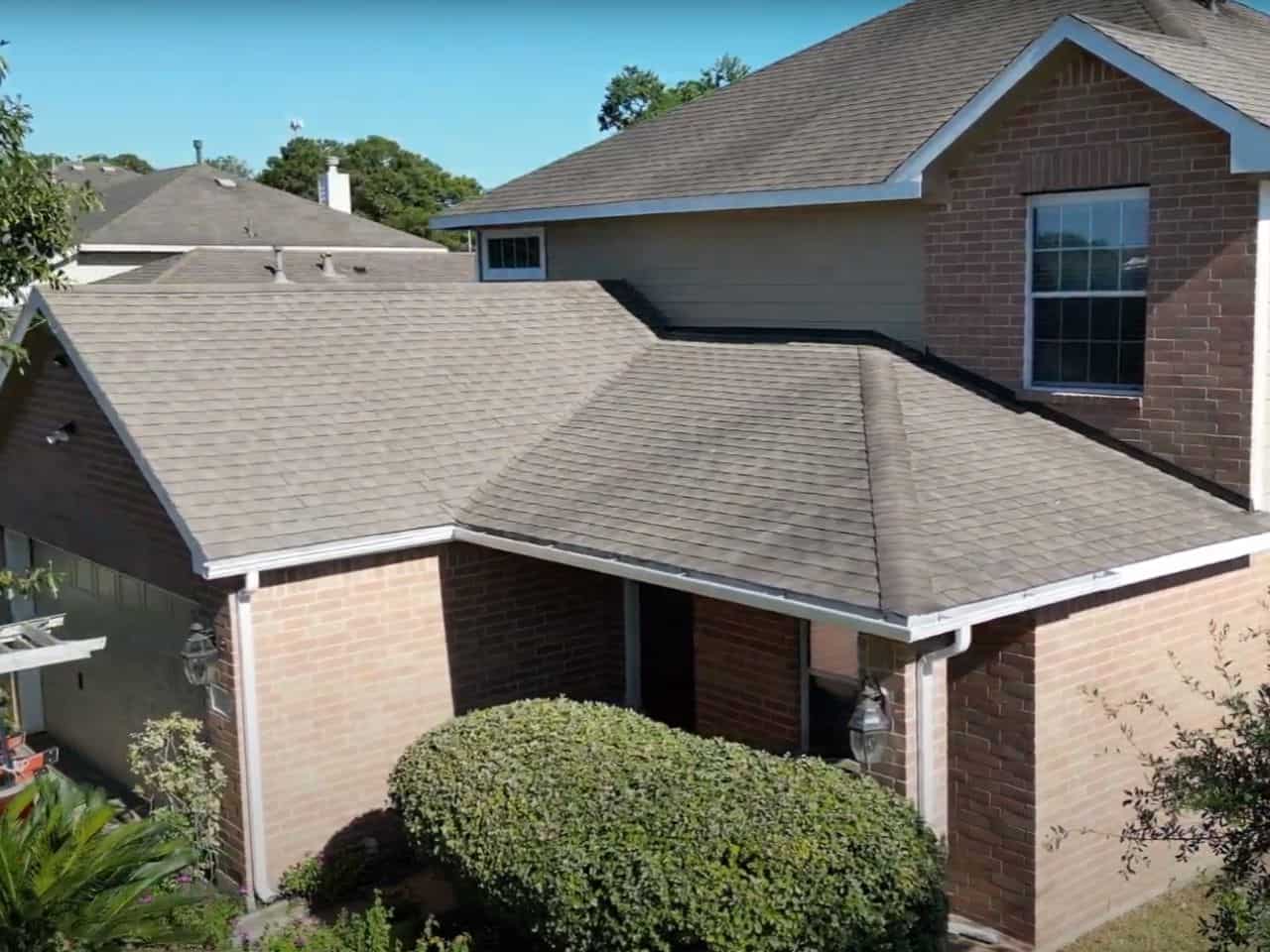 Beautiful residential house with brick exterior and well-maintained landscaping.